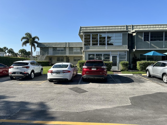 267 Flanders F, Delray Beach, FL 33484 - view of building exterior featuring uncovered parking