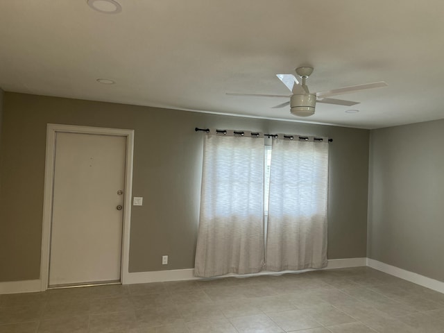 267 Flanders F, Delray Beach, FL 33484 - empty room featuring a ceiling fan and light tile patterned floors
