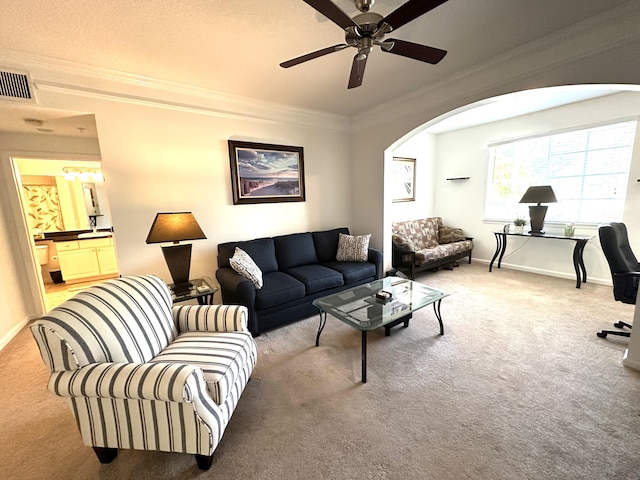 5205 Myrtlewood Cir E, Palm Beach Gardens, FL 33418 - carpeted living area featuring arched walkways, ornamental molding, ceiling fan, and baseboards