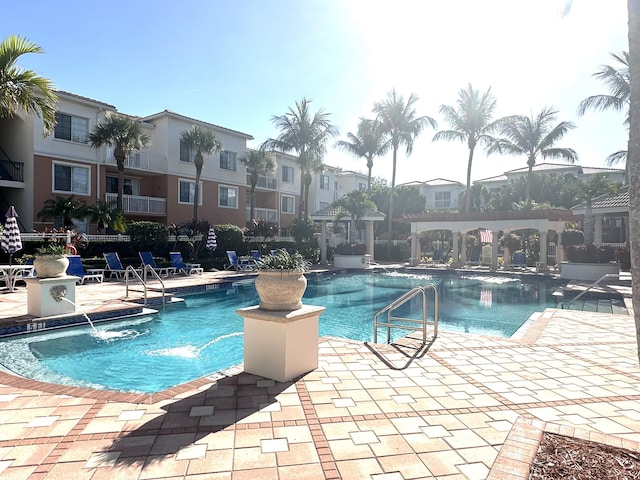 5205 Myrtlewood Cir E, Palm Beach Gardens, FL 33418 - community pool with a pergola, a patio area, and a residential view