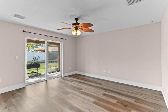 1413 Amaryllis Ln, West Palm Beach, FL 33415 - unfurnished room featuring baseboards, ceiling fan, and wood finished floors