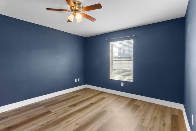 1413 Amaryllis Ln, West Palm Beach, FL 33415 - unfurnished room with baseboards, ceiling fan, and wood finished floors