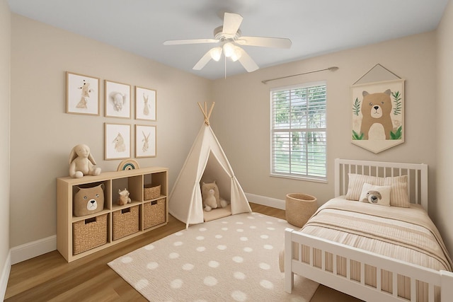 1413 Amaryllis Ln, West Palm Beach, FL 33415 - bedroom featuring wood finished floors, baseboards, and a ceiling fan
