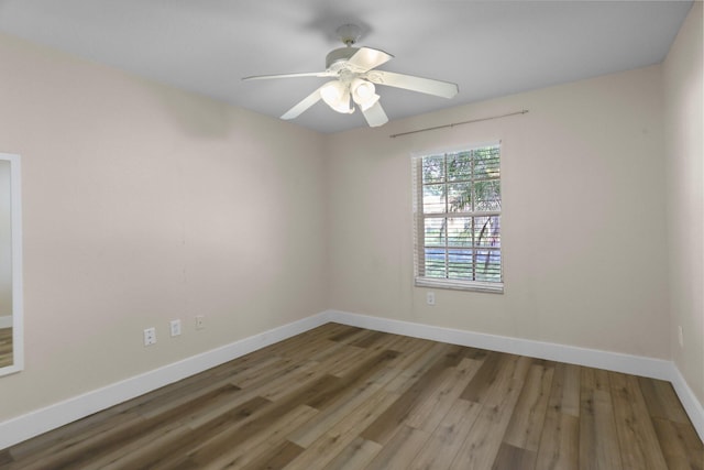 1413 Amaryllis Ln, West Palm Beach, FL 33415 - empty room featuring baseboards, wood finished floors, and ceiling fan