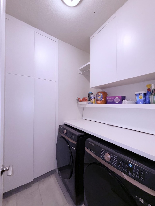 8231 Tailshot Ct, Lake Worth, FL 33467 - laundry room with separate washer and dryer, cabinet space, and light tile patterned flooring