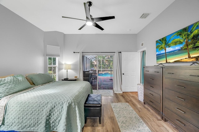 1025 Whitetail Ave SW, Vero Beach, FL 32968 - bedroom featuring access to outside, light wood finished floors, and ceiling fan