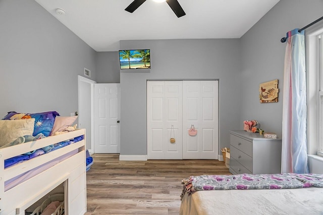 1025 Whitetail Ave SW, Vero Beach, FL 32968 - bedroom with wood finished floors, a closet, and ceiling fan