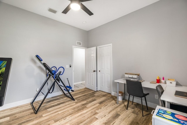 1025 Whitetail Ave SW, Vero Beach, FL 32968 - office space with wood finished floors, a ceiling fan, and baseboards