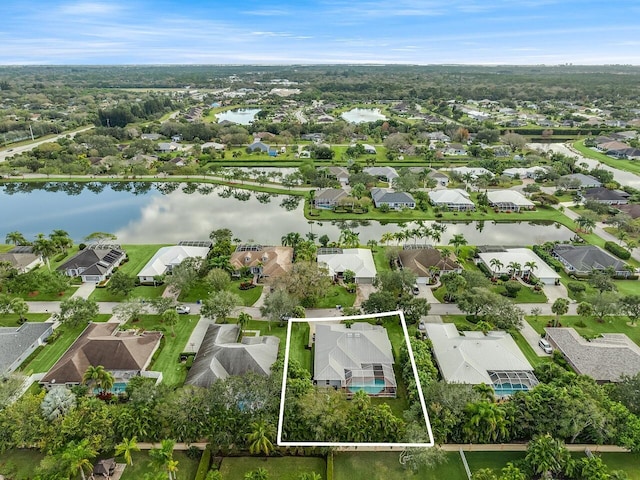 1025 Whitetail Ave SW, Vero Beach, FL 32968 - aerial perspective of suburban area with property parcel outlined and a large body of water