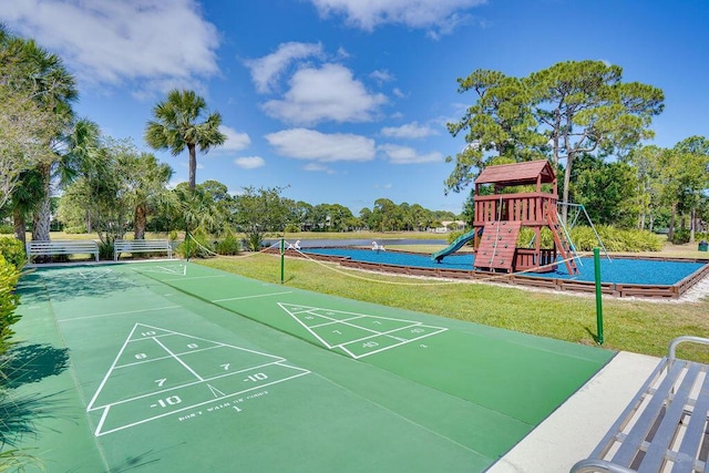 572 SW Romora Bay, Port Saint Lucie, FL 34986 - view of property's community featuring a lawn and shuffleboard