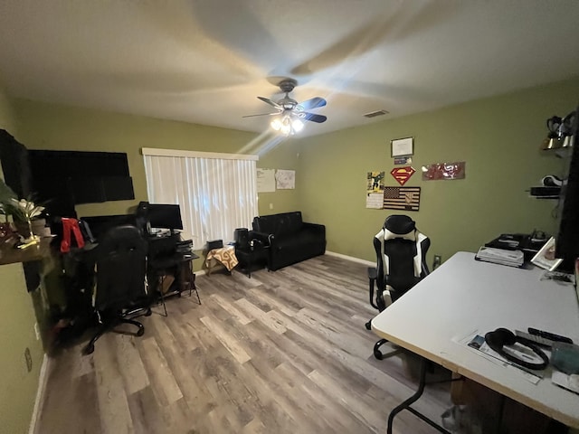 991 SE Bywood Ave, Port Saint Lucie, FL 34983 - office area with wood finished floors, a ceiling fan, and baseboards