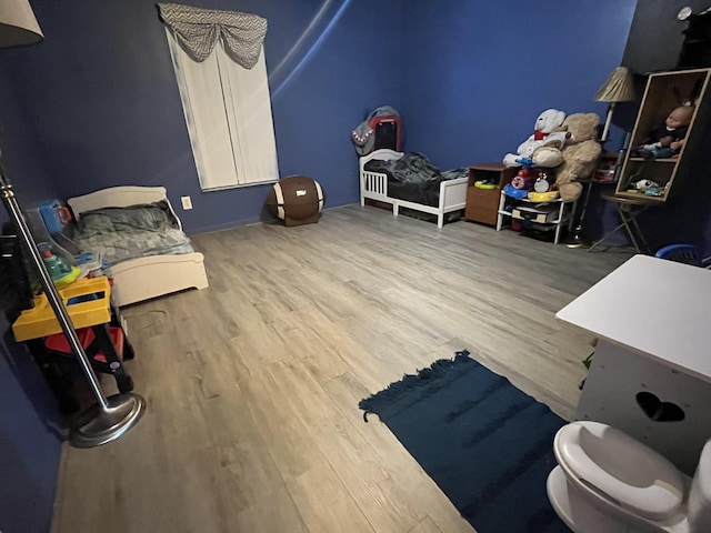 991 SE Bywood Ave, Port Saint Lucie, FL 34983 - bedroom with wood finished floors