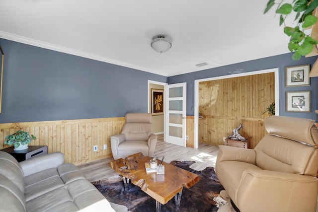 4164 Saint Andrews Dr, Boynton Beach, FL 33436 - living area with wood finished floors, a wainscoted wall, wooden walls, and ornamental molding