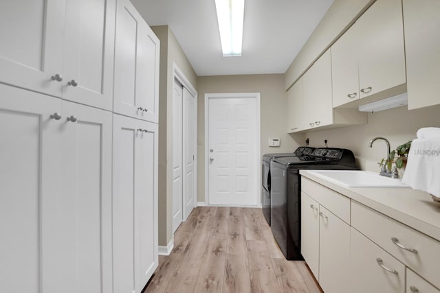 4164 Saint Andrews Dr, Boynton Beach, FL 33436 - washroom with washer and dryer, cabinet space, and light wood finished floors