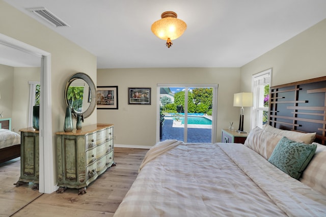 4164 Saint Andrews Dr, Boynton Beach, FL 33436 - bedroom featuring access to exterior and light wood finished floors