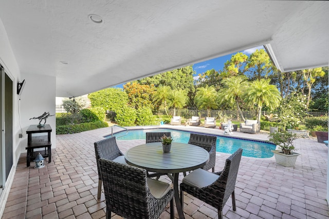 4164 Saint Andrews Dr, Boynton Beach, FL 33436 - view of pool featuring a patio, a fenced backyard, and outdoor dining area