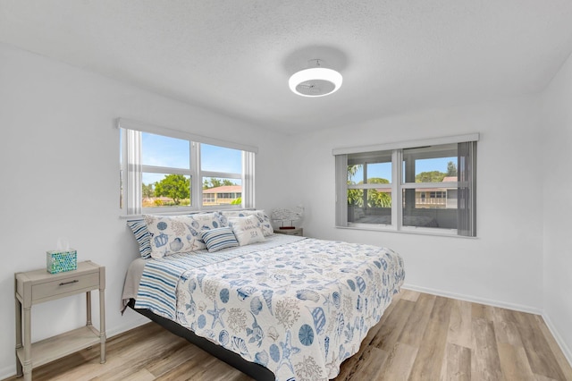 229 Chatham K, West Palm Beach, FL 33417 - bedroom with wood finished floors and baseboards