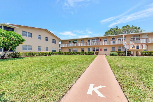 229 Chatham K, West Palm Beach, FL 33417 - surrounding community with a yard