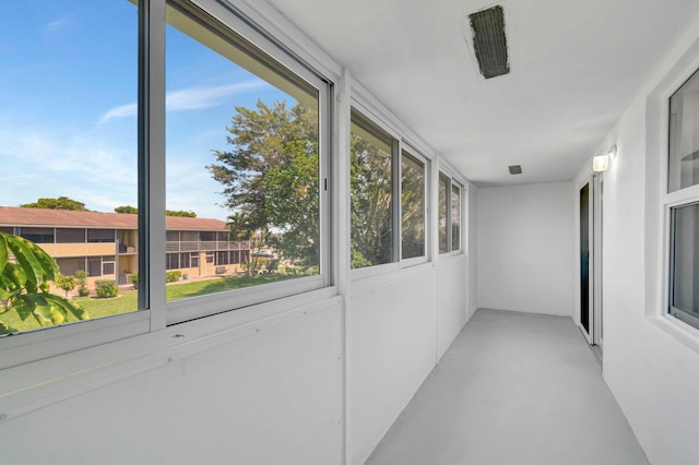 229 Chatham K, West Palm Beach, FL 33417 - unfurnished sunroom with concrete flooring
