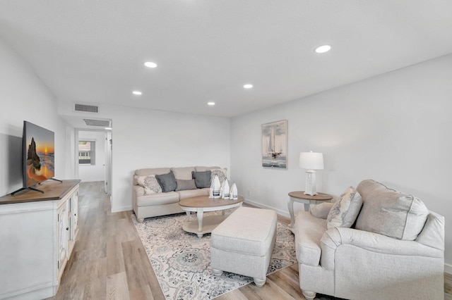 229 Chatham K, West Palm Beach, FL 33417 - living room featuring light wood-style floors, recessed lighting, and baseboards