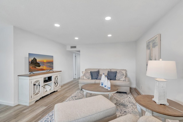 229 Chatham K, West Palm Beach, FL 33417 - living room featuring light wood-style floors, baseboards, and recessed lighting