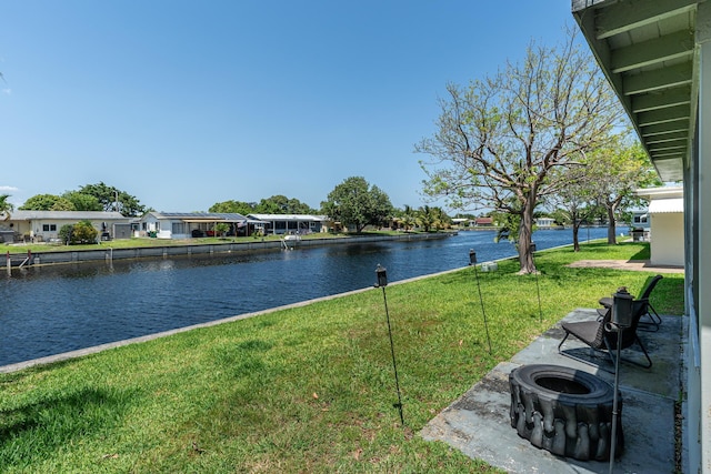 7307 NW 58th Ct, Tamarac, FL 33321 - water view with nearby suburban area and an outdoor fire pit