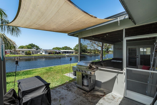 7307 NW 58th Ct, Tamarac, FL 33321 - view of patio featuring area for grilling, a water view, and french doors