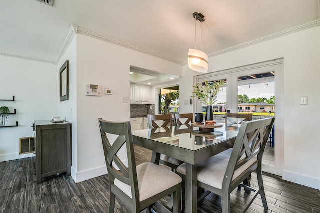 7307 NW 58th Ct, Tamarac, FL 33321 - dining room featuring ornamental molding, baseboards, and dark wood finished floors