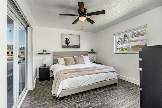 7307 NW 58th Ct, Tamarac, FL 33321 - bedroom with access to outside, a textured ceiling, multiple windows, and dark wood-style flooring