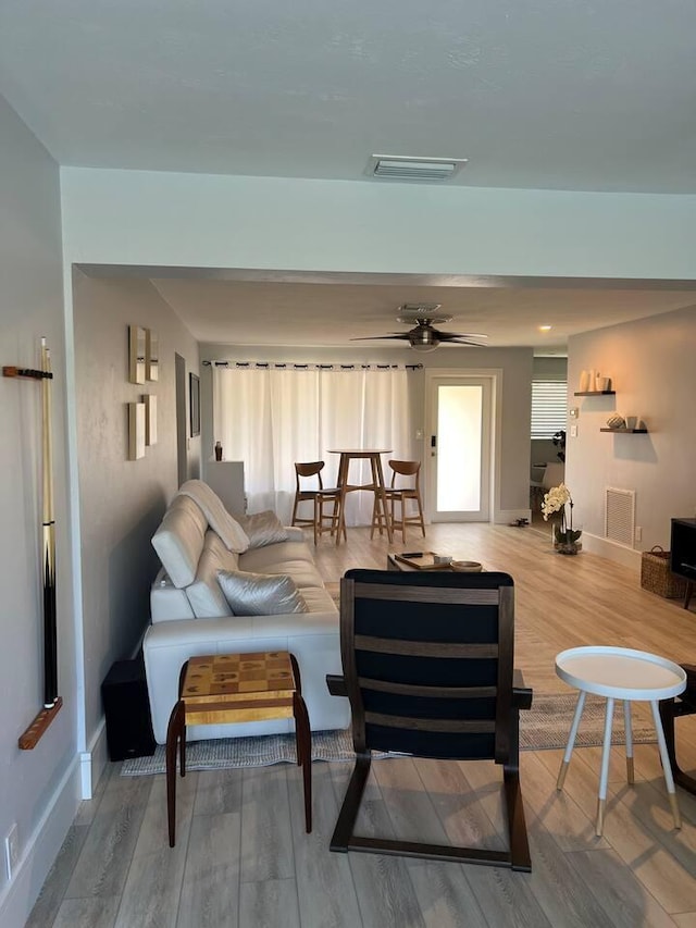 501 SE 13th Ct, Pompano Beach, FL 33060 - living area featuring wood finished floors, baseboards, and ceiling fan