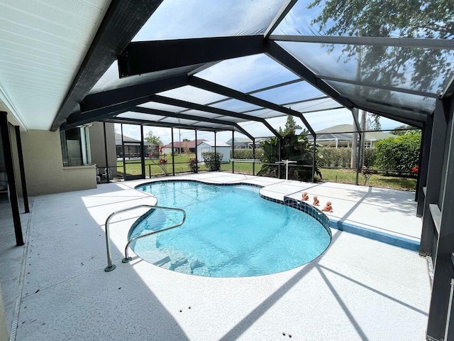 3103 SE Mall Ter S, Port Saint Lucie, FL 34984 - swimming pool featuring a patio and glass enclosure