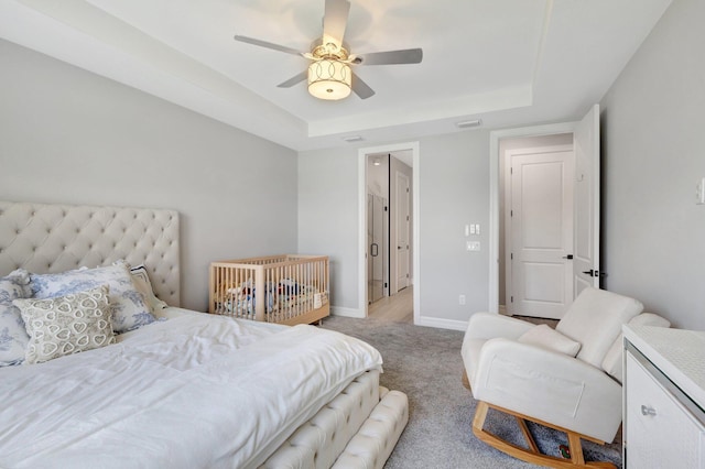 5322 Yellow Water Lily Ct, Lake Worth, FL 33467 - bedroom featuring a raised ceiling, light colored carpet, baseboards, and ceiling fan
