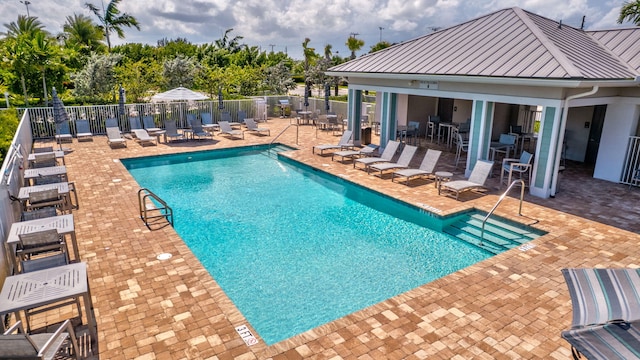 5322 Yellow Water Lily Ct, Lake Worth, FL 33467 - community pool featuring a patio area