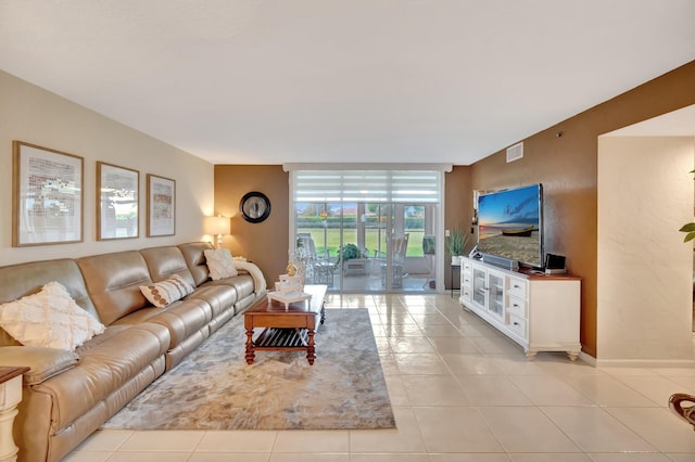 5914 Regal Glen Dr Unit 107, Boynton Beach, FL 33437 - living area featuring light tile patterned flooring and baseboards