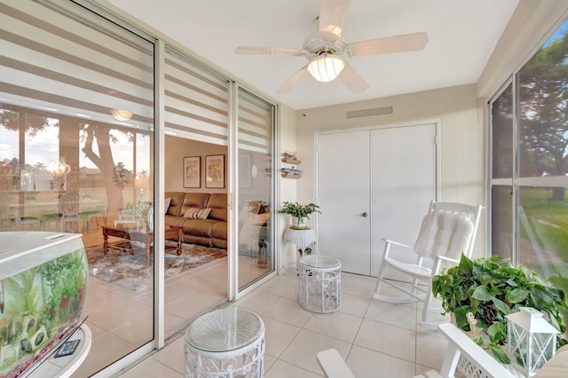 5914 Regal Glen Dr Unit 107, Boynton Beach, FL 33437 - sunroom with a ceiling fan and tile patterned floors