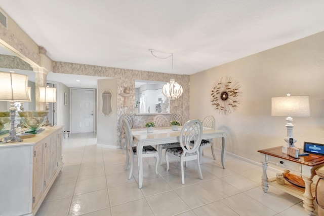 5914 Regal Glen Dr Unit 107, Boynton Beach, FL 33437 - dining area with baseboards, light tile patterned flooring, and an accent wall