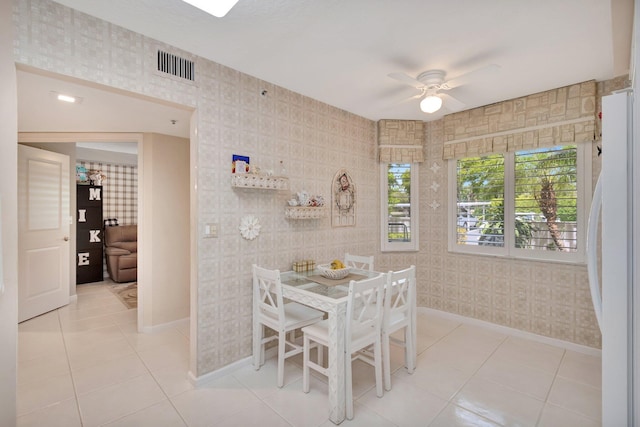 5914 Regal Glen Dr Unit 107, Boynton Beach, FL 33437 - tiled dining area featuring ceiling fan, baseboards, and wallpapered walls