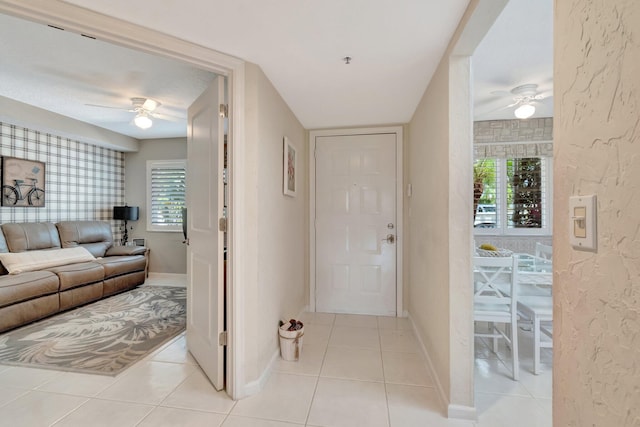 5914 Regal Glen Dr Unit 107, Boynton Beach, FL 33437 - foyer entrance with ceiling fan, light tile patterned floors, and baseboards