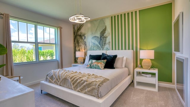 1553 SE Crosswood Way, Port Saint Lucie, FL 34984 - bedroom featuring baseboards, carpet, and a chandelier