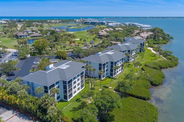 390 NE Edgewater Dr Unit 302, Stuart, FL 34996 - bird's eye view of a nearby body of water, a golf course, and apartment complex / building