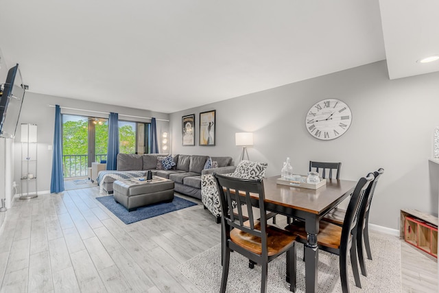 390 NE Edgewater Dr Unit 302, Stuart, FL 34996 - dining space with light wood-style floors and baseboards