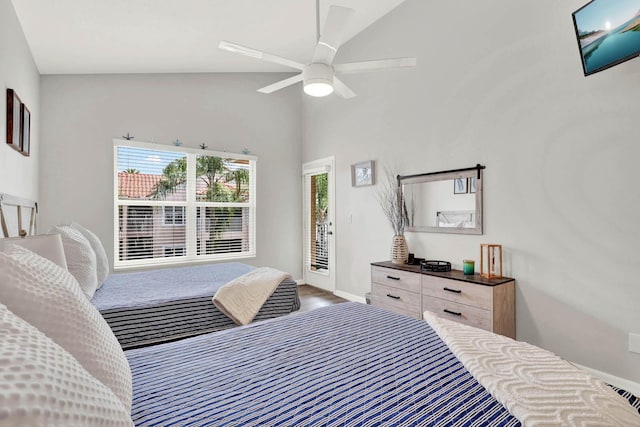 9927 Perfect Dr Unit 108, Port Saint Lucie, FL 34986 - bedroom featuring baseboards, access to outside, high vaulted ceiling, a ceiling fan, and wood finished floors