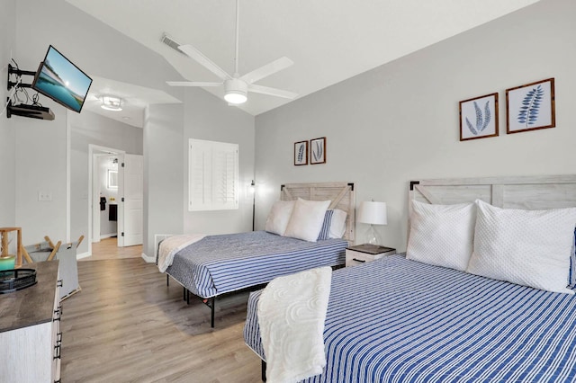 9927 Perfect Dr Unit 108, Port Saint Lucie, FL 34986 - bedroom featuring light wood-type flooring, high vaulted ceiling, a ceiling fan, and baseboards