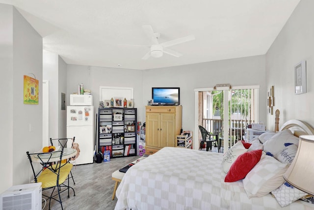 9927 Perfect Dr Unit 108, Port Saint Lucie, FL 34986 - bedroom with freestanding refrigerator, access to exterior, wood finished floors, and a ceiling fan