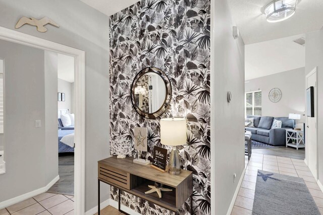 9927 Perfect Dr Unit 108, Port Saint Lucie, FL 34986 - corridor with tile patterned floors and baseboards