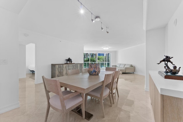 550 SE Mizner Blvd Unit B206, Boca Raton, FL 33432 - dining area featuring rail lighting and baseboards