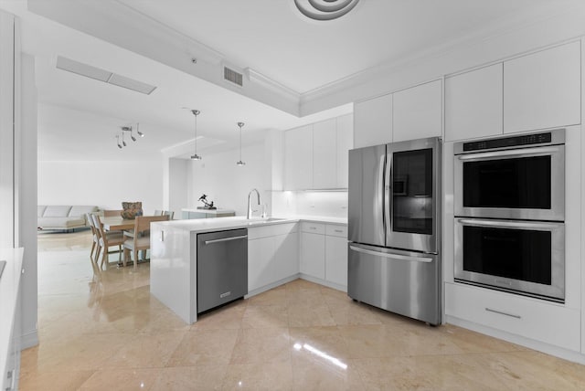 550 SE Mizner Blvd Unit B206, Boca Raton, FL 33432 - kitchen with appliances with stainless steel finishes, crown molding, a peninsula, white cabinets, and light countertops
