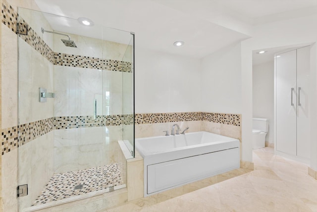 550 SE Mizner Blvd Unit B206, Boca Raton, FL 33432 - bathroom featuring a garden tub, a stall shower, toilet, and recessed lighting