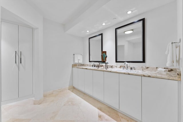 550 SE Mizner Blvd Unit B206, Boca Raton, FL 33432 - bathroom featuring double vanity, recessed lighting, and baseboards