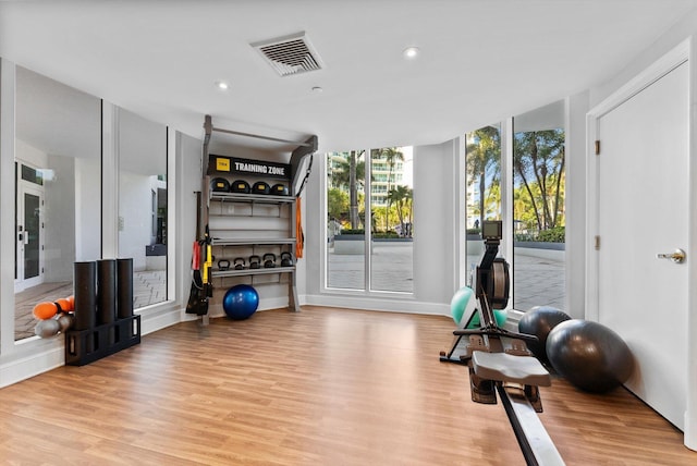550 SE Mizner Blvd Unit B206, Boca Raton, FL 33432 - workout area featuring wood finished floors, recessed lighting, and baseboards